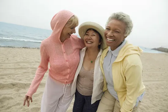 Women laughing on the beach