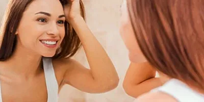 Girl looking into the mirror